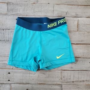 nike pros teal